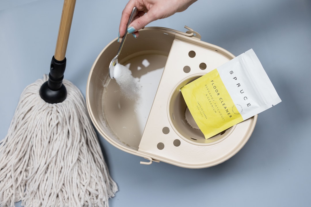 adding-cleaning-powder-to-a-mop-bucket-dym3cv1r4i0